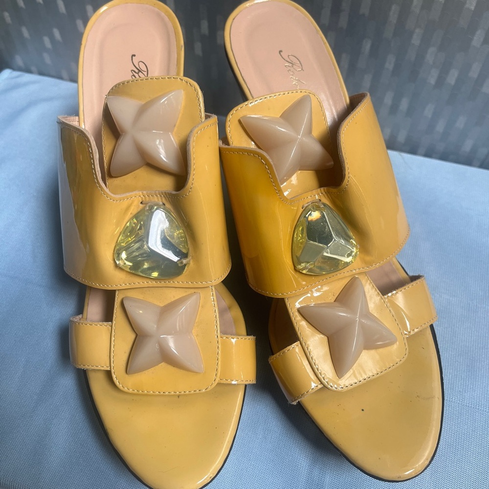 Woman slide sandals with stars by Robert Clergerie. 100% leather, made in France